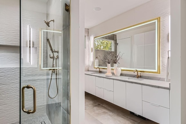 bathroom with vanity, tile patterned floors, and walk in shower