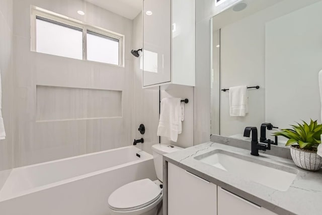 full bathroom with vanity, toilet, and washtub / shower combination