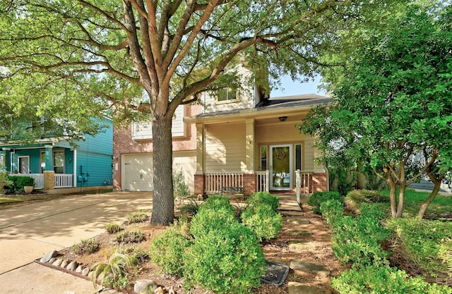 view of front of house featuring a garage and covered porch