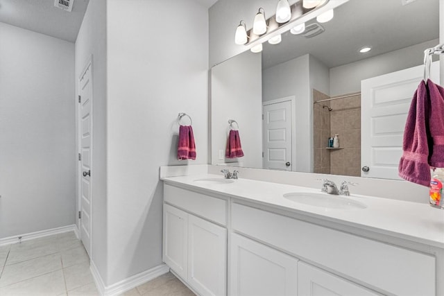 bathroom with tile patterned flooring and vanity