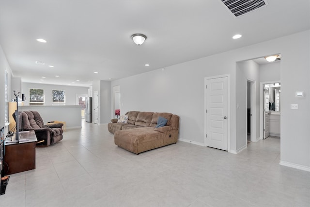 living room with light tile patterned floors