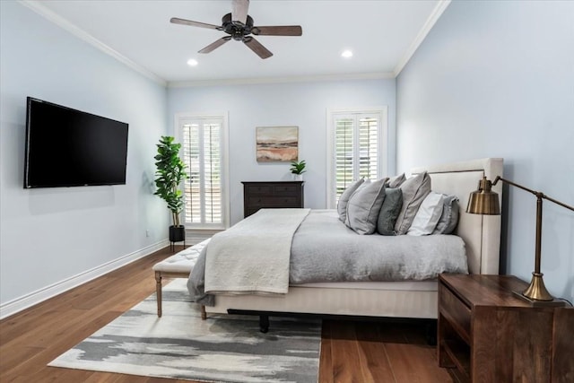 bedroom featuring multiple windows, ceiling fan, crown molding, and wood-type flooring