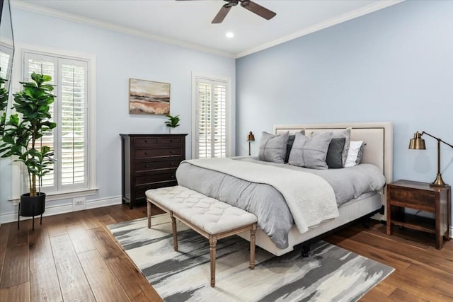 bedroom featuring multiple windows, ceiling fan, and dark hardwood / wood-style floors