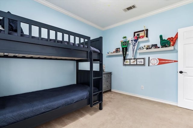 bedroom featuring carpet flooring and crown molding