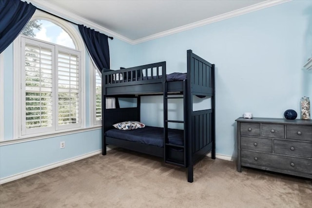 carpeted bedroom featuring multiple windows and crown molding