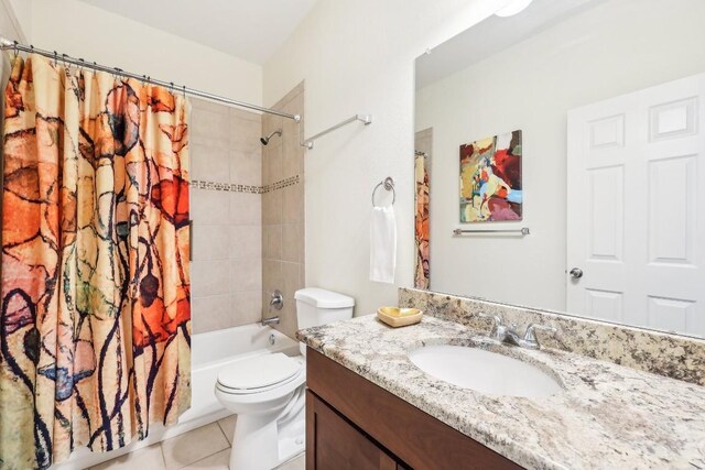 full bathroom featuring tile patterned floors, vanity, shower / bathtub combination with curtain, and toilet