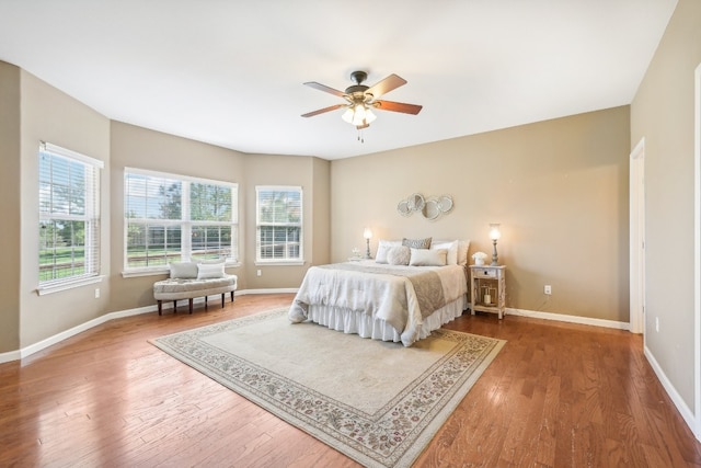 bedroom with hardwood / wood-style flooring and ceiling fan