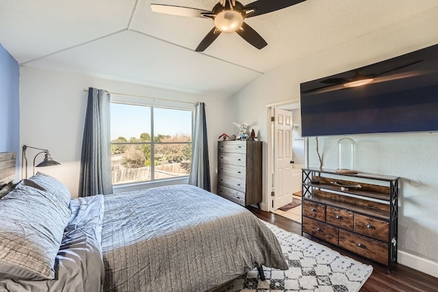 bedroom featuring hardwood / wood-style flooring, ceiling fan, and lofted ceiling