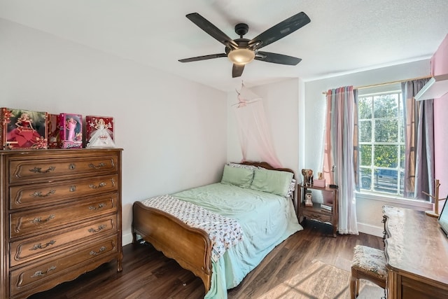 bedroom with ceiling fan and dark hardwood / wood-style flooring