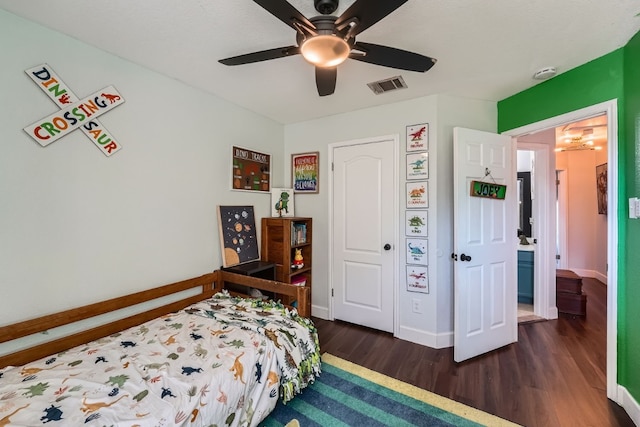 bedroom featuring ceiling fan and dark hardwood / wood-style flooring