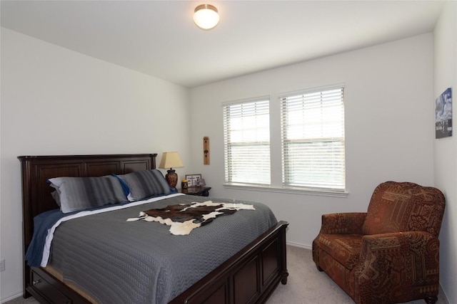 bedroom with light colored carpet