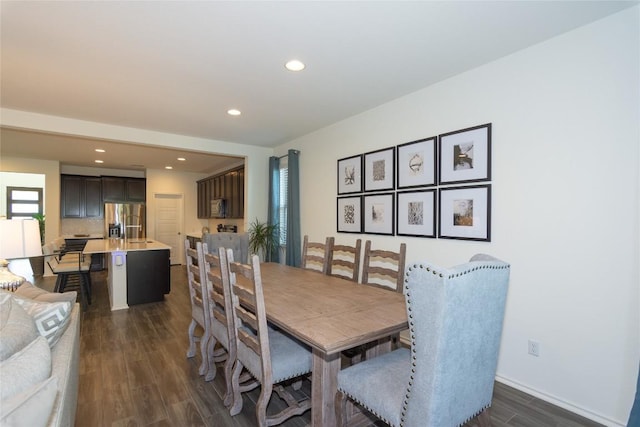 dining area featuring dark hardwood / wood-style floors