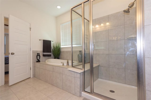 bathroom featuring separate shower and tub and tile patterned floors