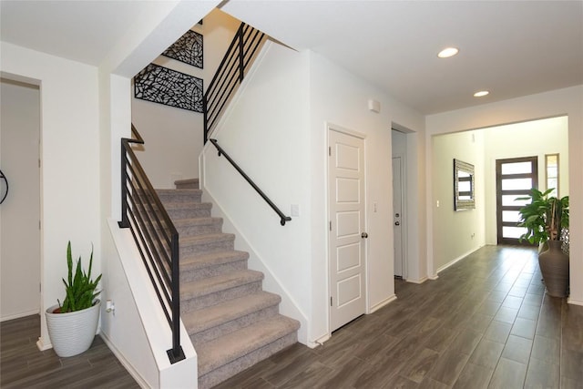 stairway with wood-type flooring