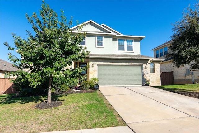 view of front of home with a front yard and a garage