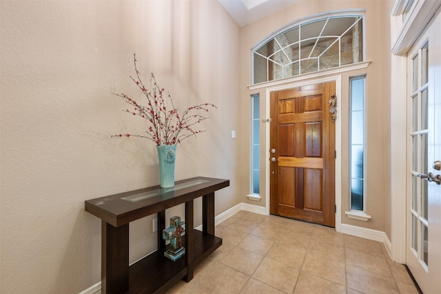 foyer featuring light tile patterned floors