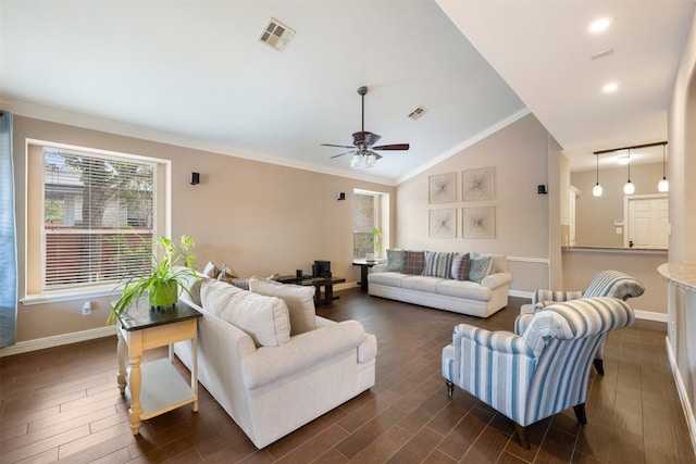 living room with vaulted ceiling, a wealth of natural light, crown molding, and dark hardwood / wood-style floors