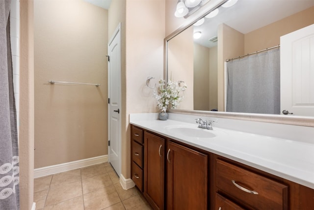 bathroom featuring tile patterned flooring and vanity