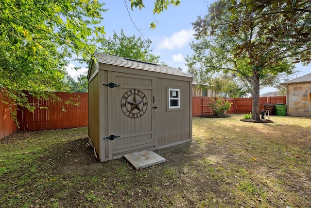 view of outbuilding with a yard