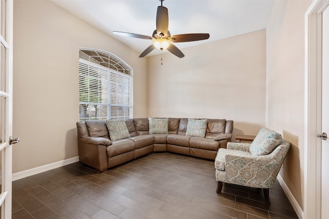 living room featuring dark hardwood / wood-style floors and ceiling fan