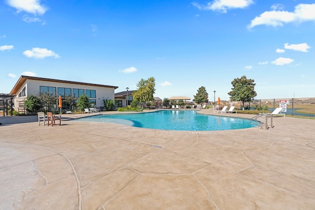 view of swimming pool featuring a patio area