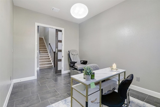 home office with dark tile patterned floors