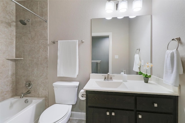 full bathroom with vanity, toilet, and tiled shower / bath