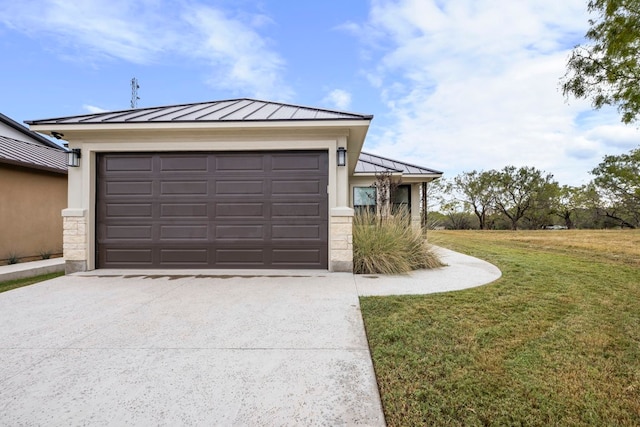 garage featuring a lawn