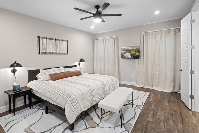 bedroom featuring ceiling fan and dark hardwood / wood-style floors