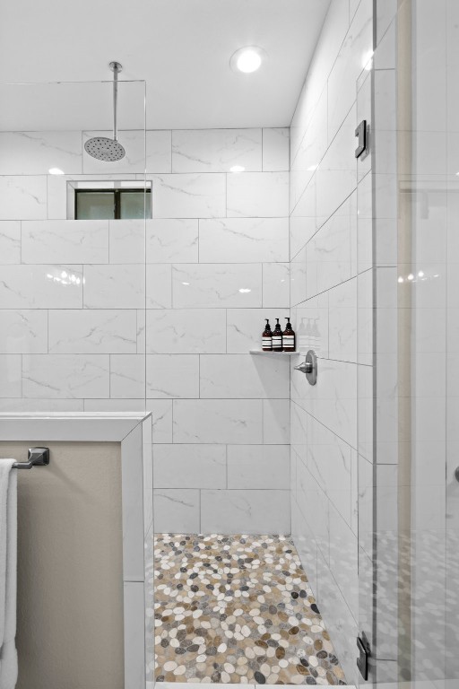 bathroom with a tile shower