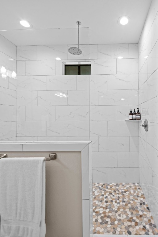 bathroom with tiled shower