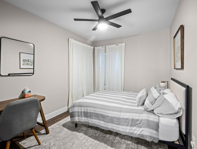 bedroom featuring hardwood / wood-style flooring and ceiling fan