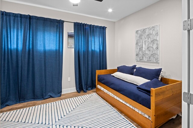 bedroom featuring ceiling fan and hardwood / wood-style floors