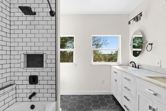 bathroom featuring vanity, tile patterned flooring, and tiled shower / bath combo