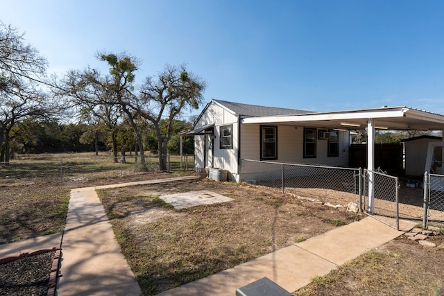 view of home's exterior with a carport