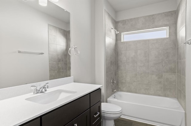 full bath featuring vanity, toilet, shower / bathtub combination, and wood finished floors