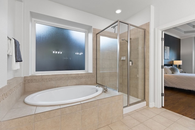 bathroom featuring independent shower and bath and wood-type flooring