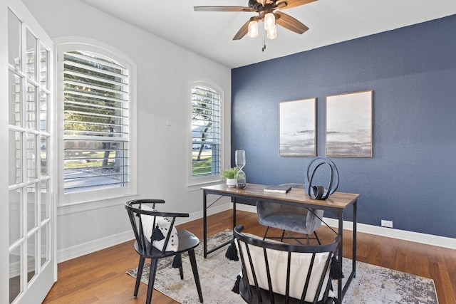 office featuring wood-type flooring and ceiling fan