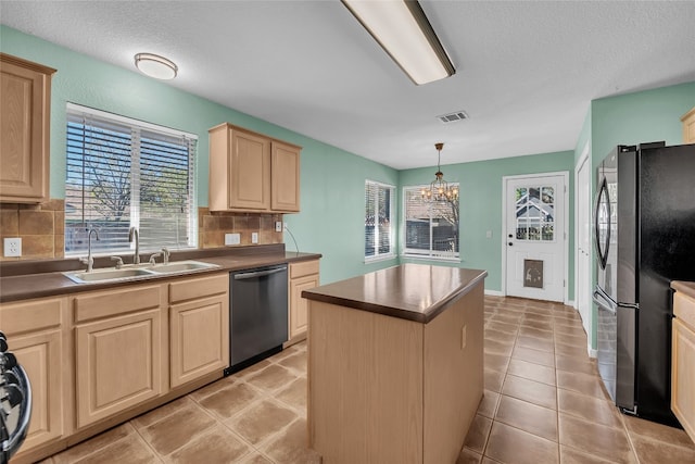 kitchen with backsplash, stainless steel appliances, hanging light fixtures, and sink