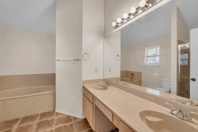 bathroom with a bathing tub, vanity, and toilet