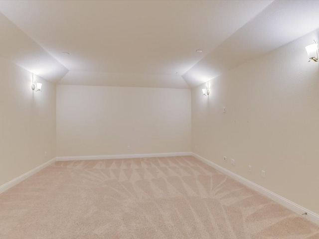 8061 Massa Dr, Round Rock, TX 78665 - additional living space with vaulted ceiling, light colored carpet, and baseboards