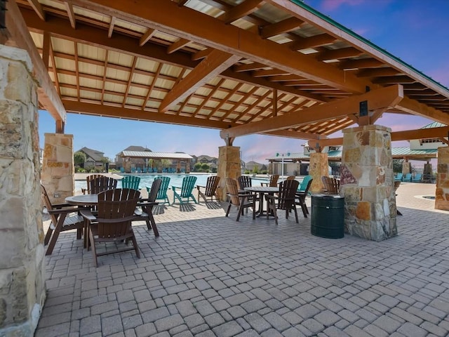 8061 Massa Dr, Round Rock, TX 78665 - patio terrace at dusk with outdoor dining area and a patio
