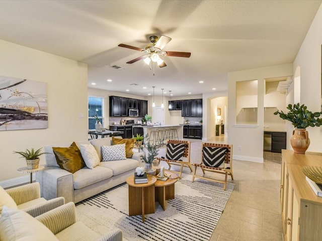 tiled living room featuring ceiling fan