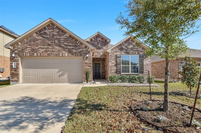 view of front of home featuring a garage, concrete driveway, brick siding, and a front lawn