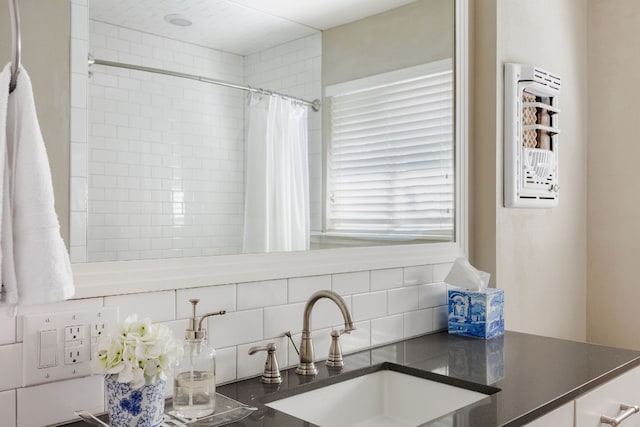 kitchen with tasteful backsplash and sink