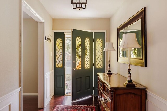 foyer with dark hardwood / wood-style floors