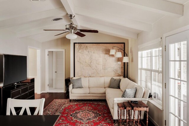 living room featuring vaulted ceiling with beams, ceiling fan, and dark wood-type flooring