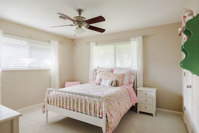 bedroom featuring light carpet and ceiling fan