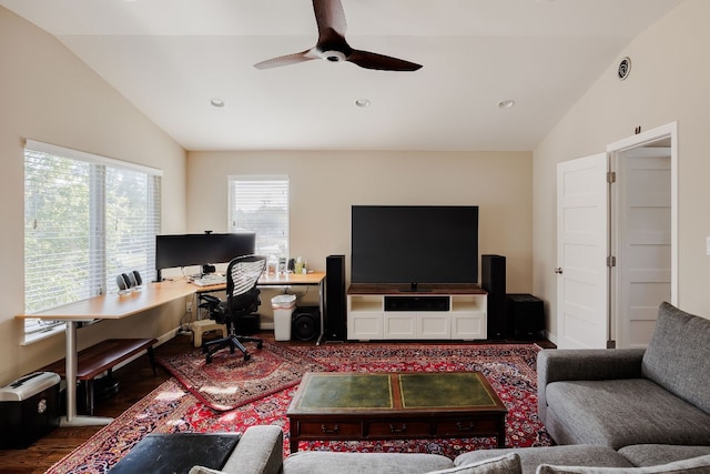 living room with dark hardwood / wood-style flooring, ceiling fan, and lofted ceiling