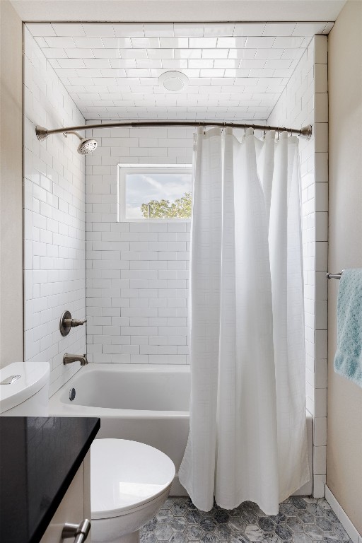 full bathroom with vanity, toilet, and shower / bath combo